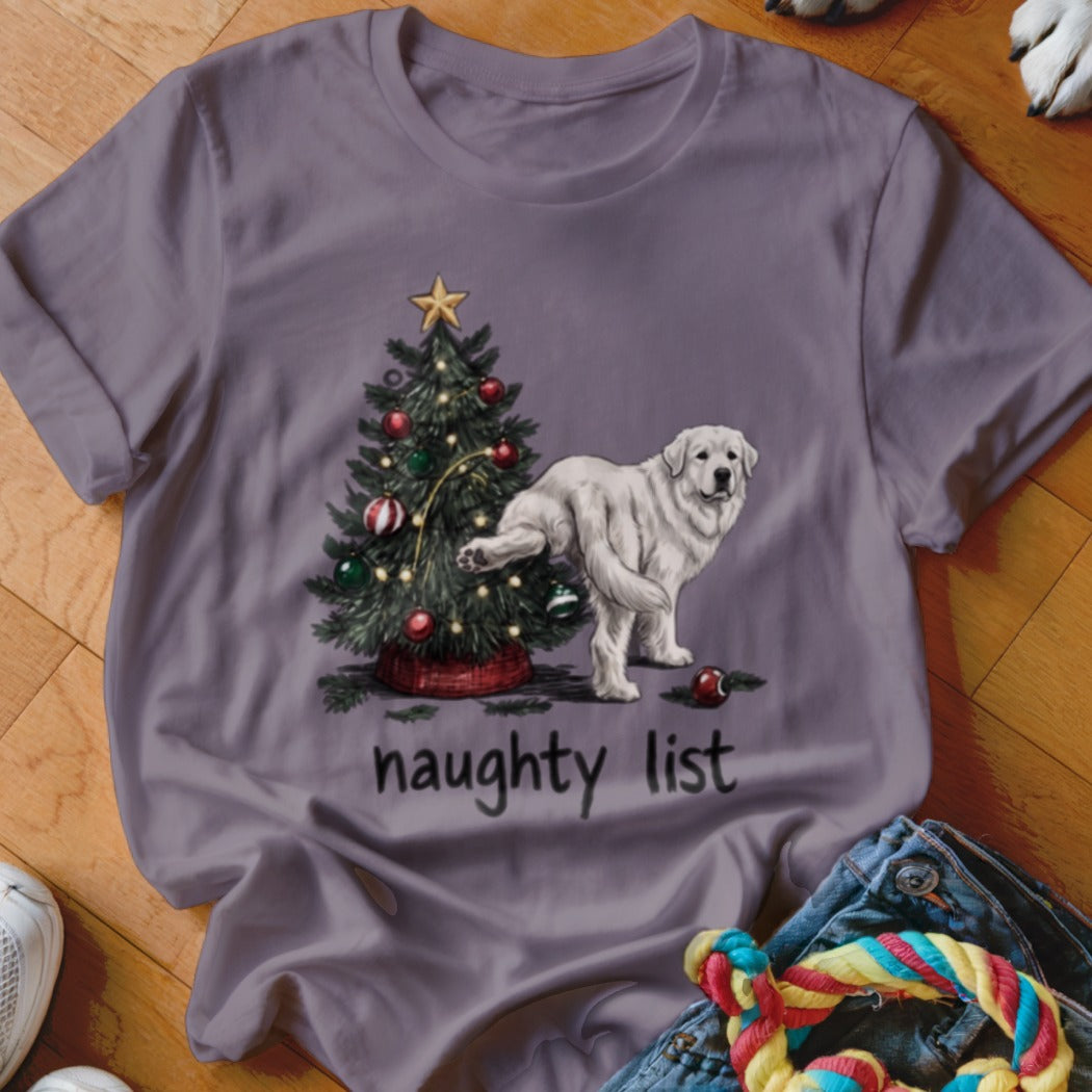 A gray t-shirt with a graphic of a white dog lifting its leg against a Christmas tree, above the text "naughty list".
