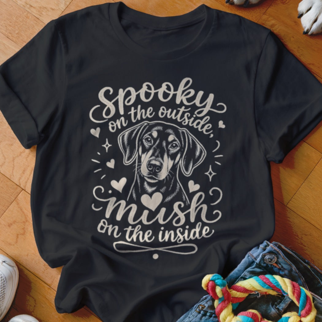 Black t-shirt with a Doberman graphic and text "Spooky on the outside, mush on the inside."