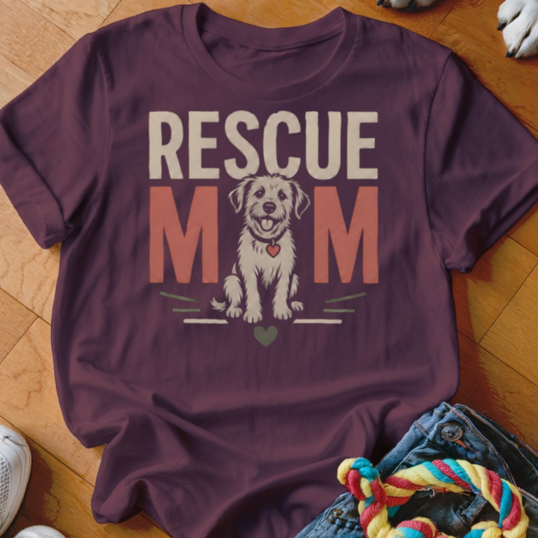 Rescue Mom text with seated dog graphic on maroon t-shirt