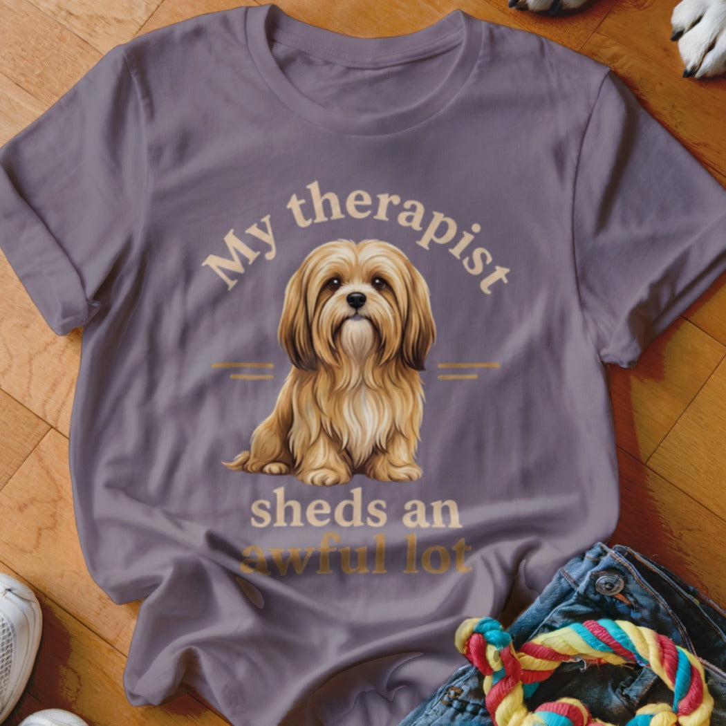 T-shirt with text "My therapist sheds an awful lot" and a shaggy dog illustration.
