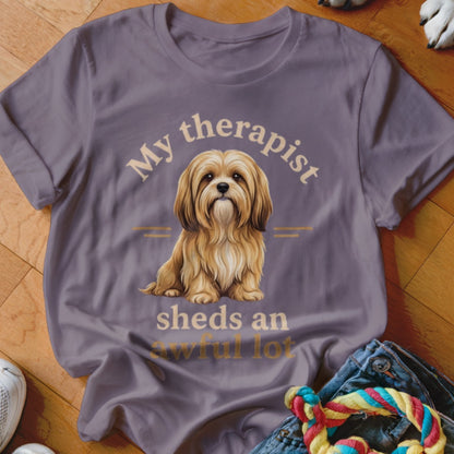 T-shirt with text "My therapist sheds an awful lot" and a shaggy dog illustration.