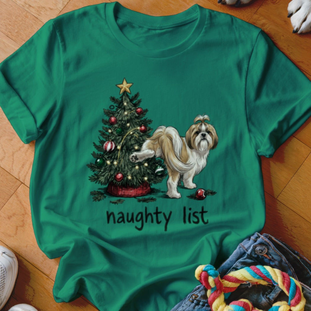 Green t-shirt featuring a Shih Tzu lifting its leg on a Christmas tree with the text naughty list.
