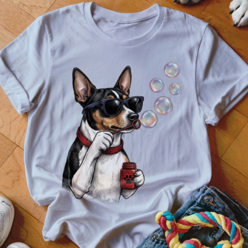 White t-shirt featuring an illustration of a dog wearing sunglasses and blowing soap bubbles.