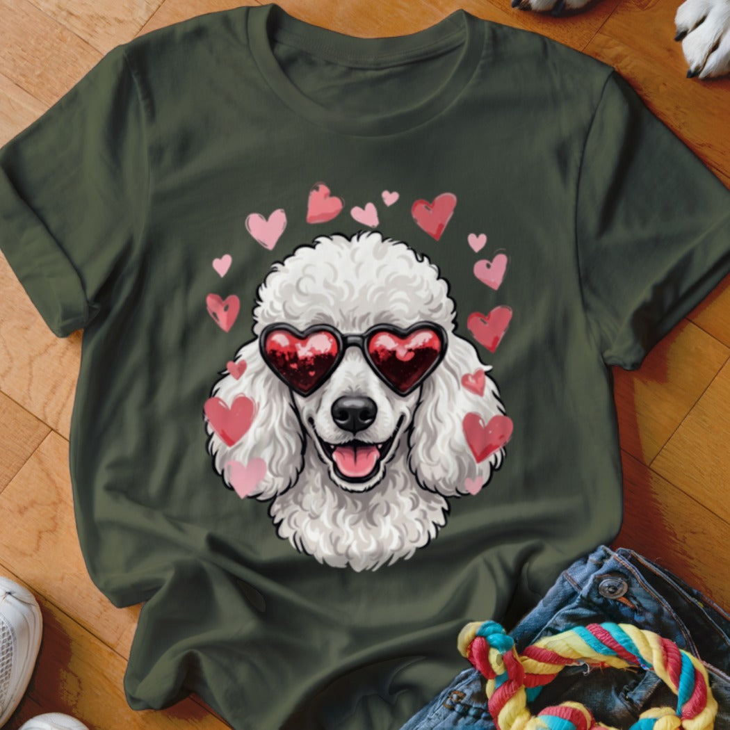 Dark green t-shirt featuring a graphic of a white poodle wearing heart-shaped sunglasses surrounded by floating pink hearts.