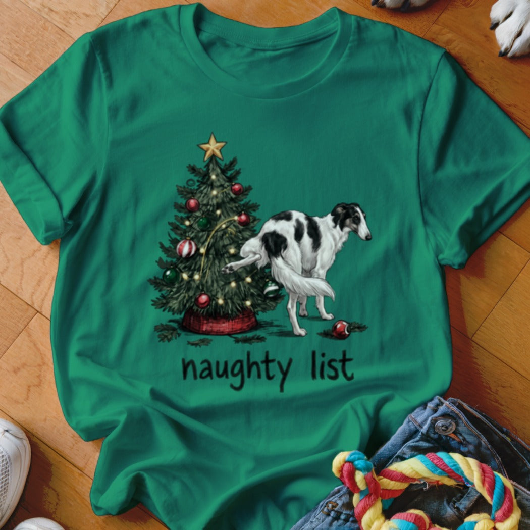 A green t-shirt features a graphic of a dog lifting its leg against a Christmas tree, with the text "naughty list" below.