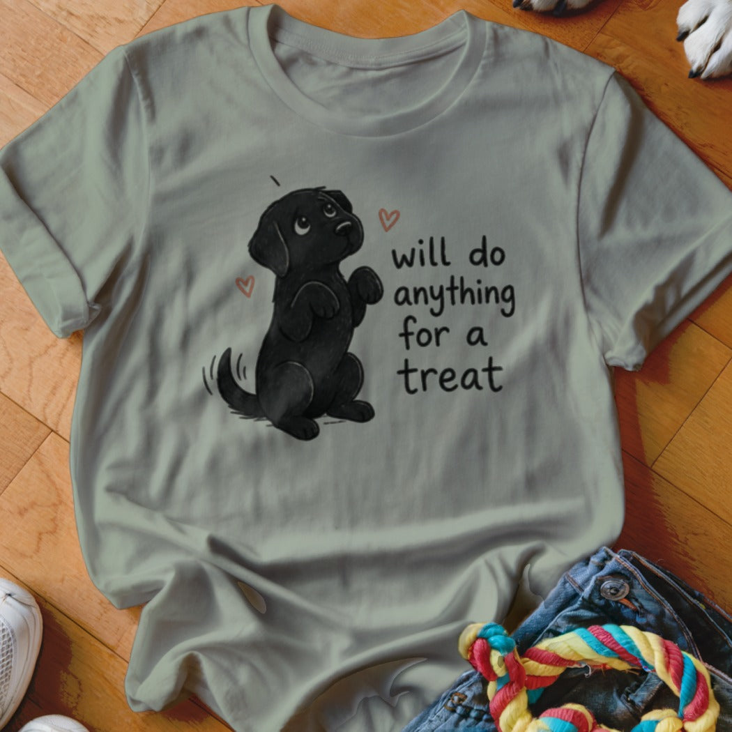 Black lab puppy graphic with "will do anything for a treat" text on a light t-shirt.