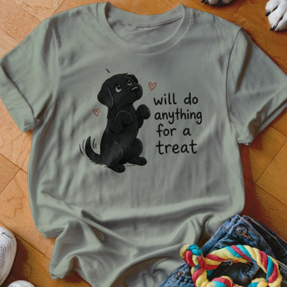 Black lab puppy graphic with "will do anything for a treat" text on a light t-shirt.