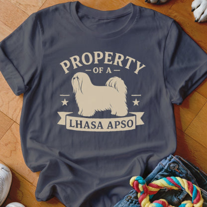 Dark blue t-shirt with white graphic reading "Property Of A Lhasa Apso" and dog silhouette.