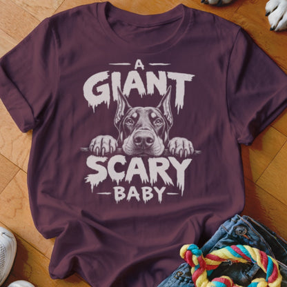 Maroon t-shirt with "A Giant Scary Baby" text and Doberman face graphic.