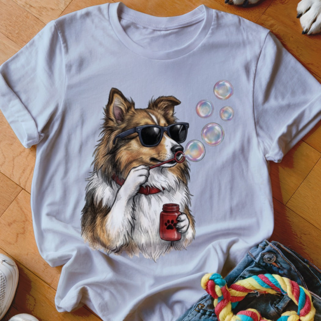 A white short-sleeved t-shirt featuring a graphic of a dog wearing sunglasses and blowing bubbles.