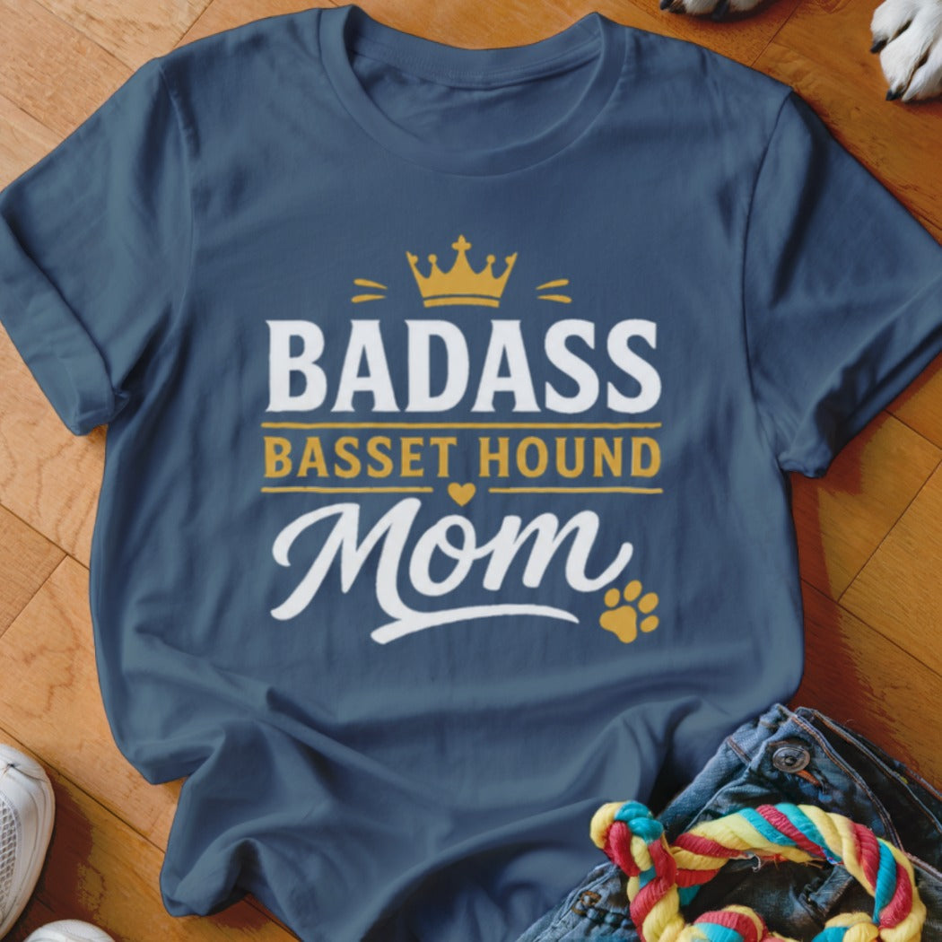 "Badass Basset Hound Mom" text on a navy blue t-shirt with crown and paw print.