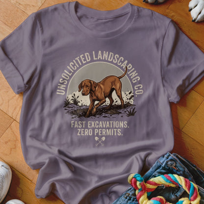 T-shirt with dog digging, "Unsolicited Landscaping Co." and "Fast Excavations. Zero Permits." text.