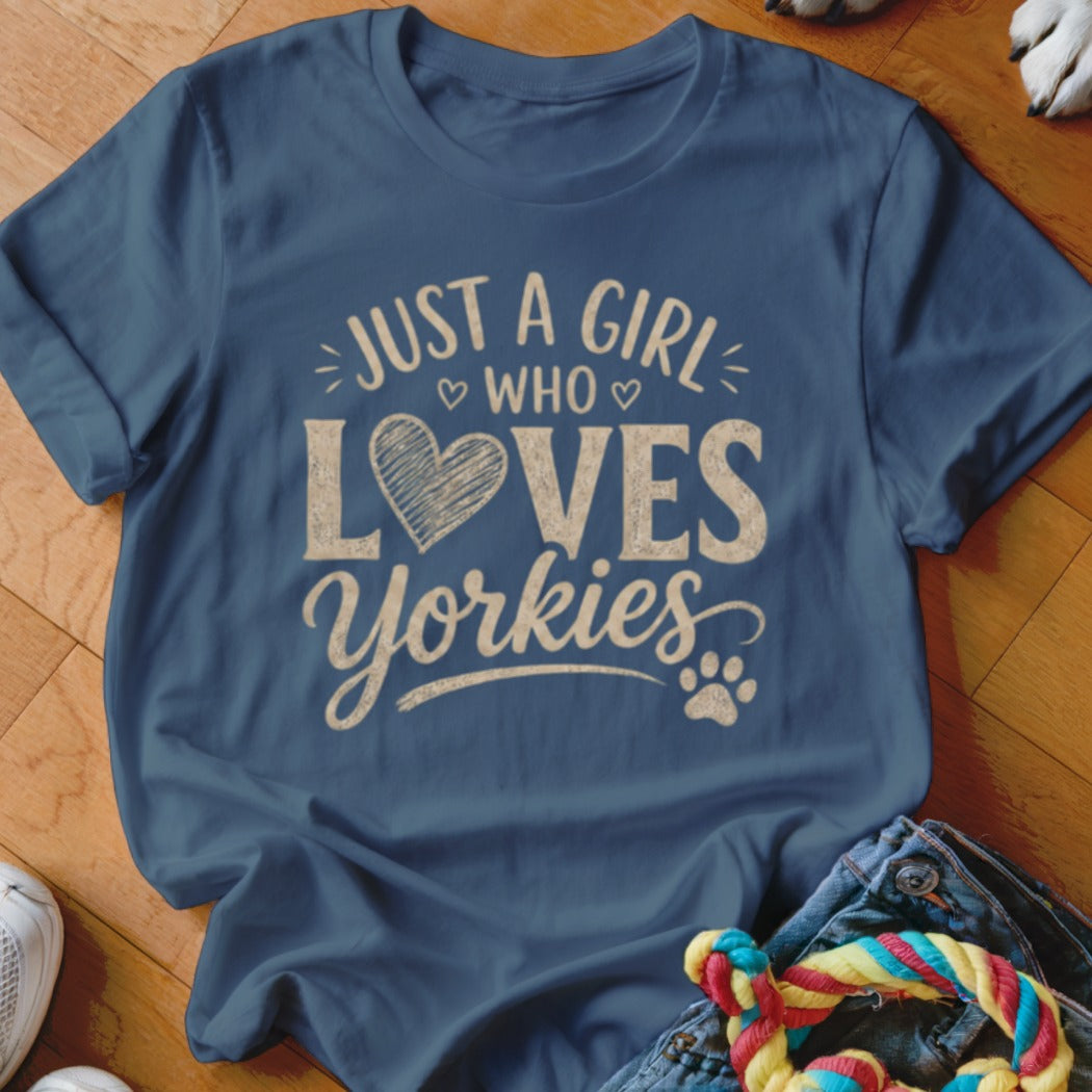 Blue t-shirt with text "JUST A GIRL WHO LOVES Yorkies" and a heart.