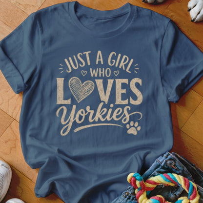 Blue t-shirt with text "JUST A GIRL WHO LOVES Yorkies" and a heart.