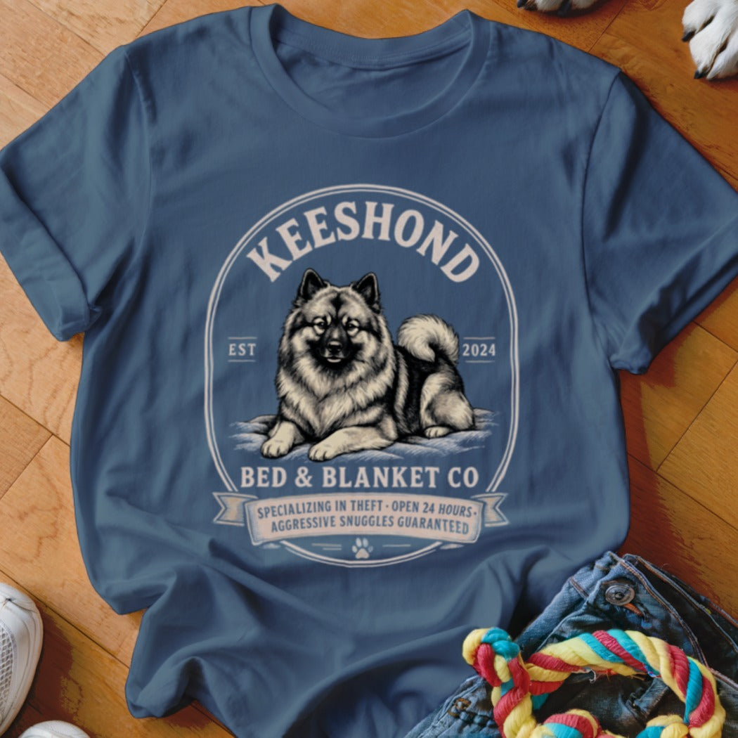Blue t-shirt with a Keeshond dog illustration and "Bed & Blanket Co" text.