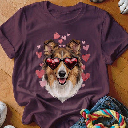 Maroon short-sleeved t-shirt featuring a graphic of a collie wearing heart-shaped sunglasses surrounded by pink hearts.