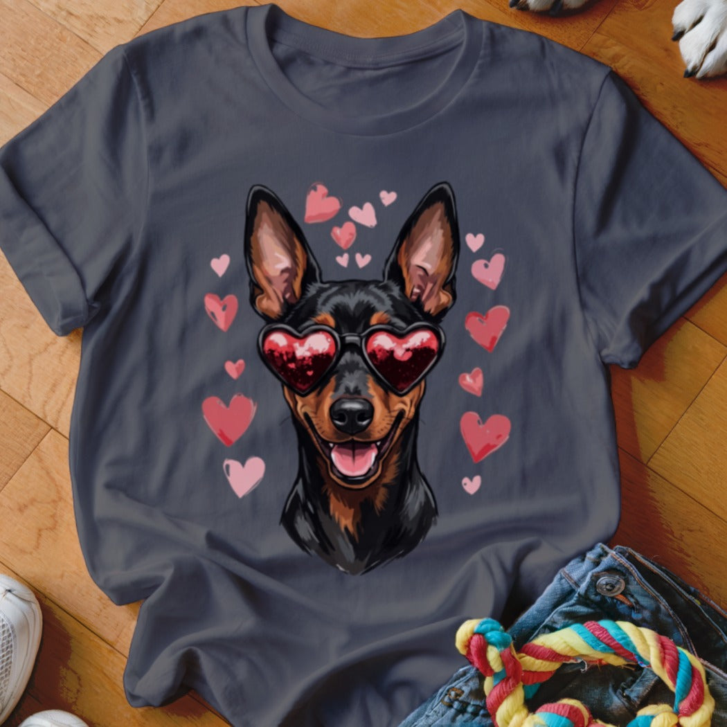 Charcoal grey t-shirt featuring a graphic of a Doberman pinscher wearing heart-shaped sunglasses surrounded by pink hearts.