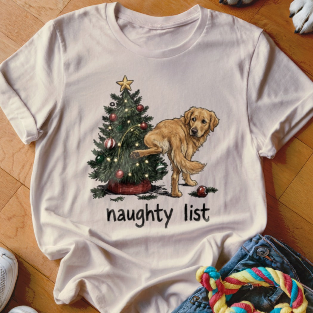 Golden retriever near Christmas tree with text "naughty list"