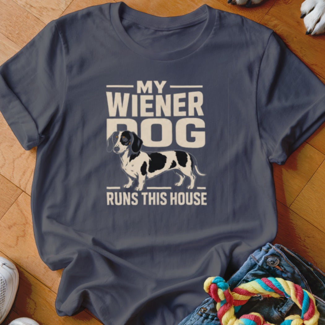 T-shirt with illustration of a dachshund and the text "MY WIENER DOG RUNS THIS HOUSE".