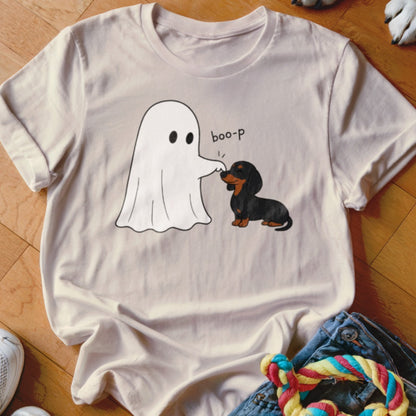Ghost poking a dachshund with "boo-p" text on a light tan t-shirt.