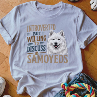 White t-shirt with "INTROVERTED BUT WILLING TO DISCUSS SAMOYEDS" text and a Samoyed dog illustration.