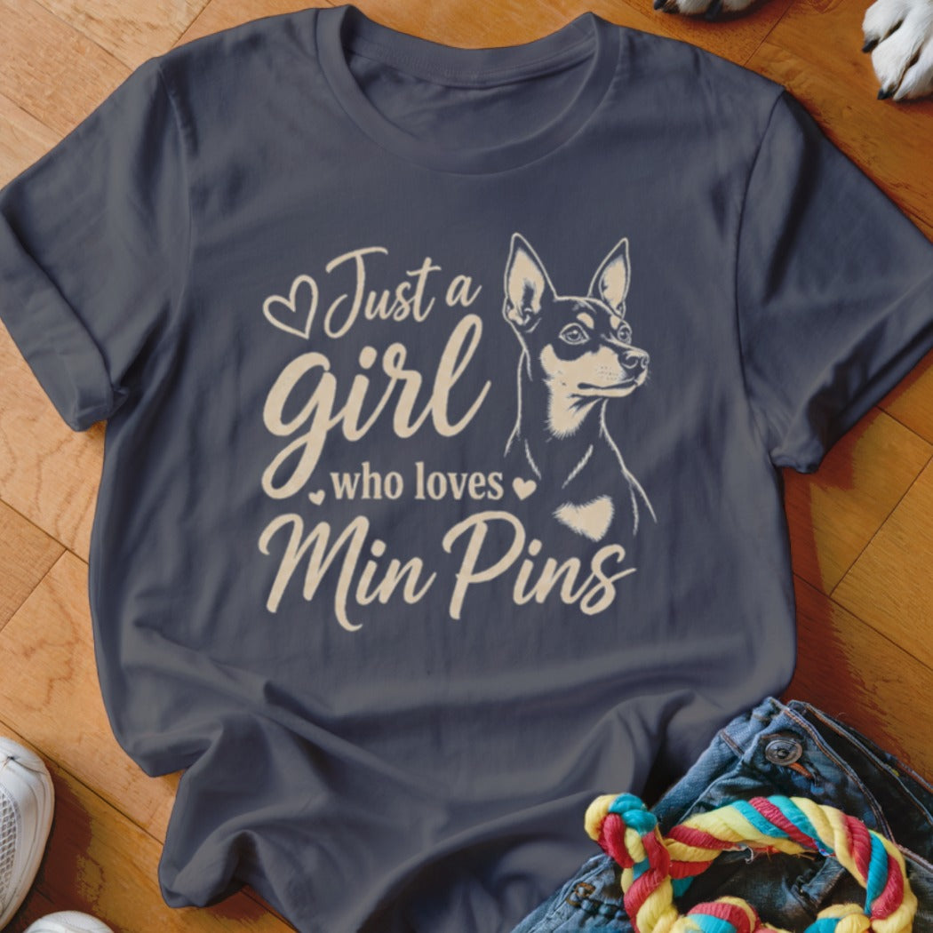 Dark blue t-shirt with "Just a girl who loves Min Pins" text and dog graphic.