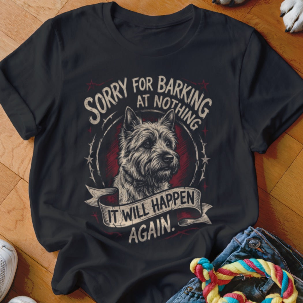 Black t-shirt featuring a graphic of a terrier and text that reads Sorry for barking at nothing. It will happen again.