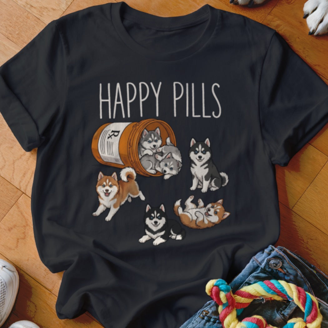 Black t-shirt with "HAPPY PILLS" text and illustration of huskies spilling from a pill bottle.