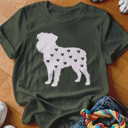 White dog silhouette filled with black hearts on a dark green t-shirt.