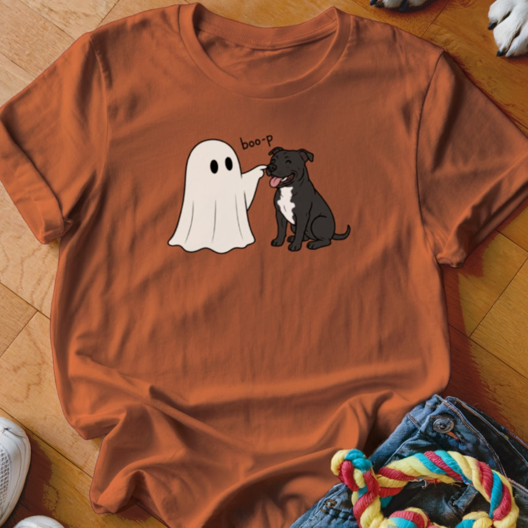 Ghost touching a dog's nose with "boo-p" text on an orange t-shirt.