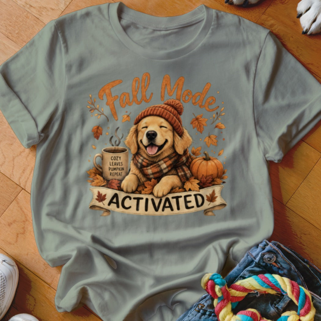 Golden retriever in beanie and scarf with coffee and pumpkin, text "Fall Mode Activated".