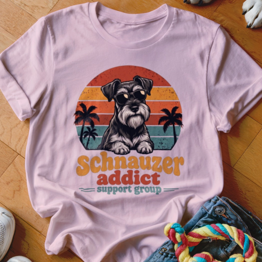 Light pink t-shirt featuring a retro graphic of a Schnauzer in sunglasses with palm trees.