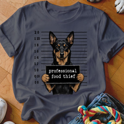 Dog wearing a sign that says "professional food thief" in a mugshot.