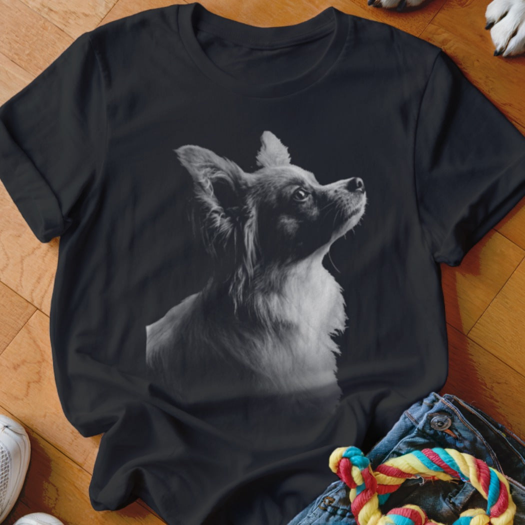Black t-shirt with a grayscale portrait of a long-haired chihuahua looking upwards.