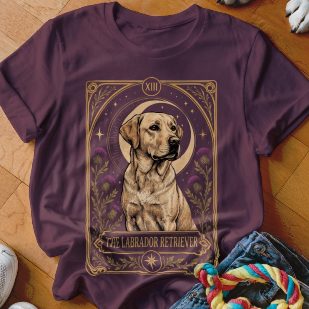 Dark purple t-shirt featuring a tarot card graphic of a yellow Labrador Retriever with floral accents and text.