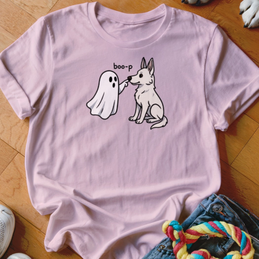 Pink t-shirt with a cartoon ghost saying "boo-p" to a white dog.