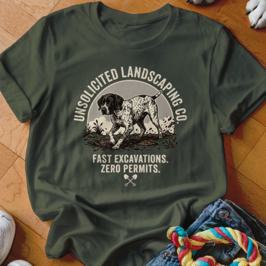 Green t-shirt with a dog and text: Unsolicited Landscaping Co. Fast Excavations. Zero Permits.