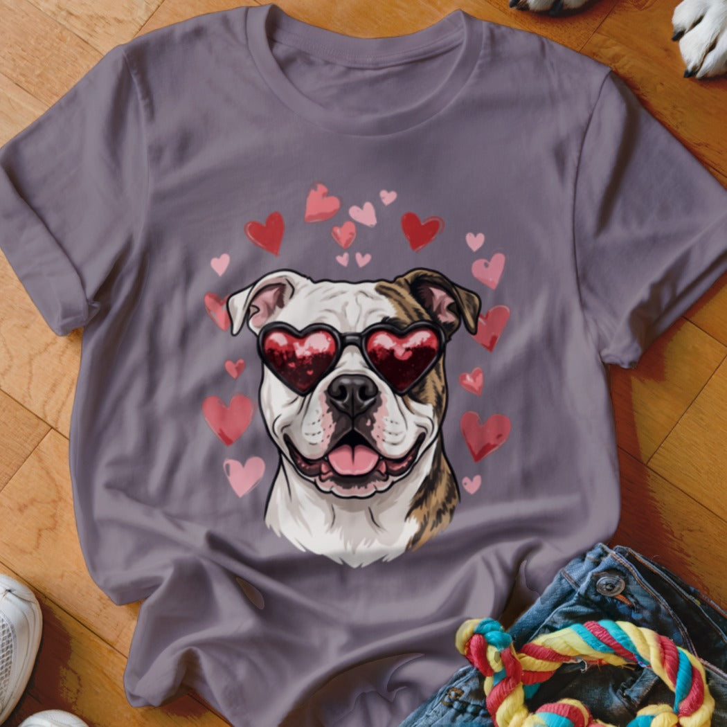 Gray t-shirt featuring an illustration of a bulldog wearing heart-shaped sunglasses surrounded by pink and red hearts.