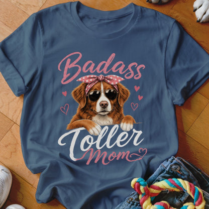 Blue t-shirt with a dog wearing sunglasses and a bandana, reading "Badass Toller Mom".