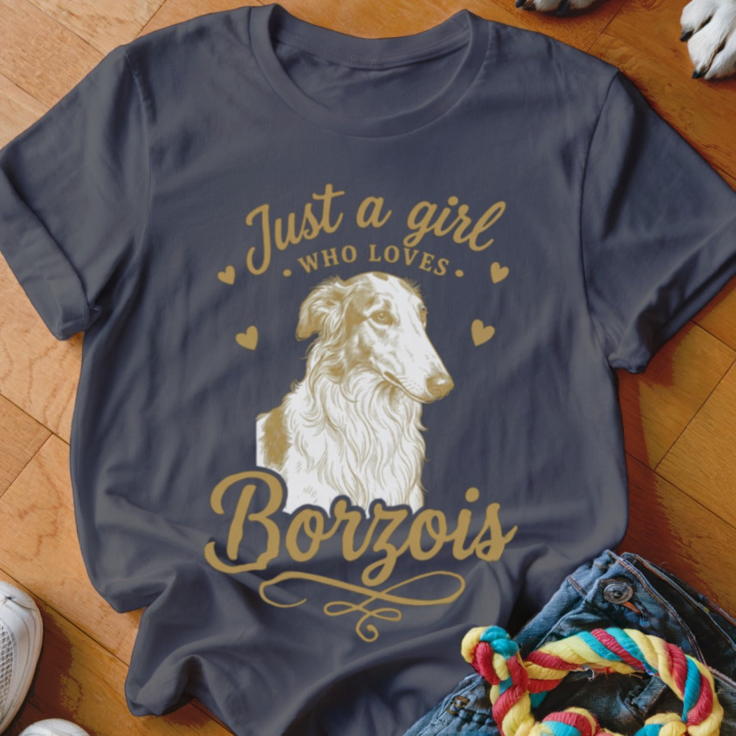 A dark gray t-shirt with gold text reading Just a girl who loves Borzois and a Borzoi graphic.