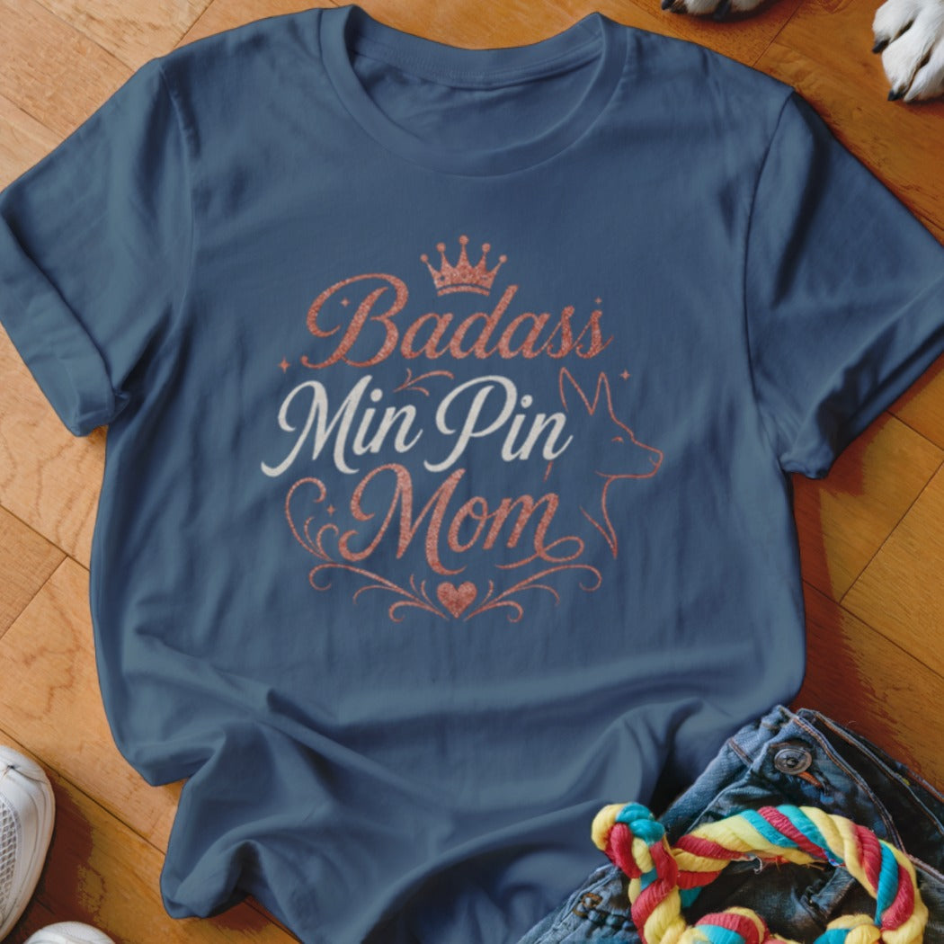 Navy t-shirt with "Badass Min Pin Mom" text and a min pin silhouette.