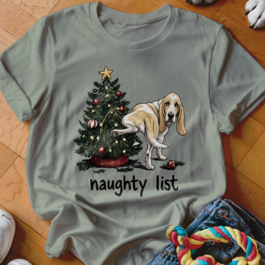 Basset Hound near a Christmas tree with text "naughty list".