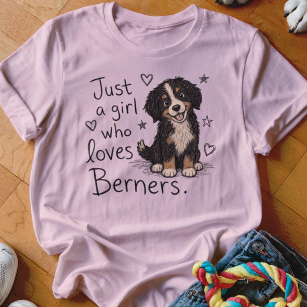 Pink t-shirt with text "Just a girl who loves Berners" and a cartoon Bernese Mountain Dog.