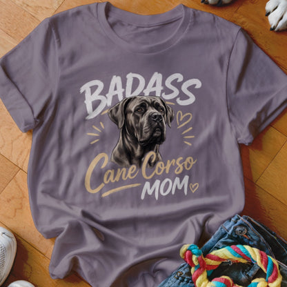 A grey t-shirt featuring an illustration of a Cane Corso and the text Badass Cane Corso Mom.