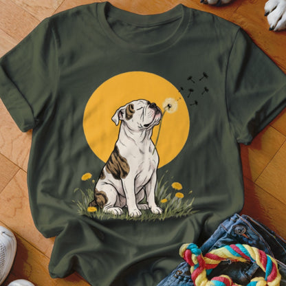 A dark green t-shirt featuring an illustration of a bulldog blowing on a dandelion against a yellow sun.