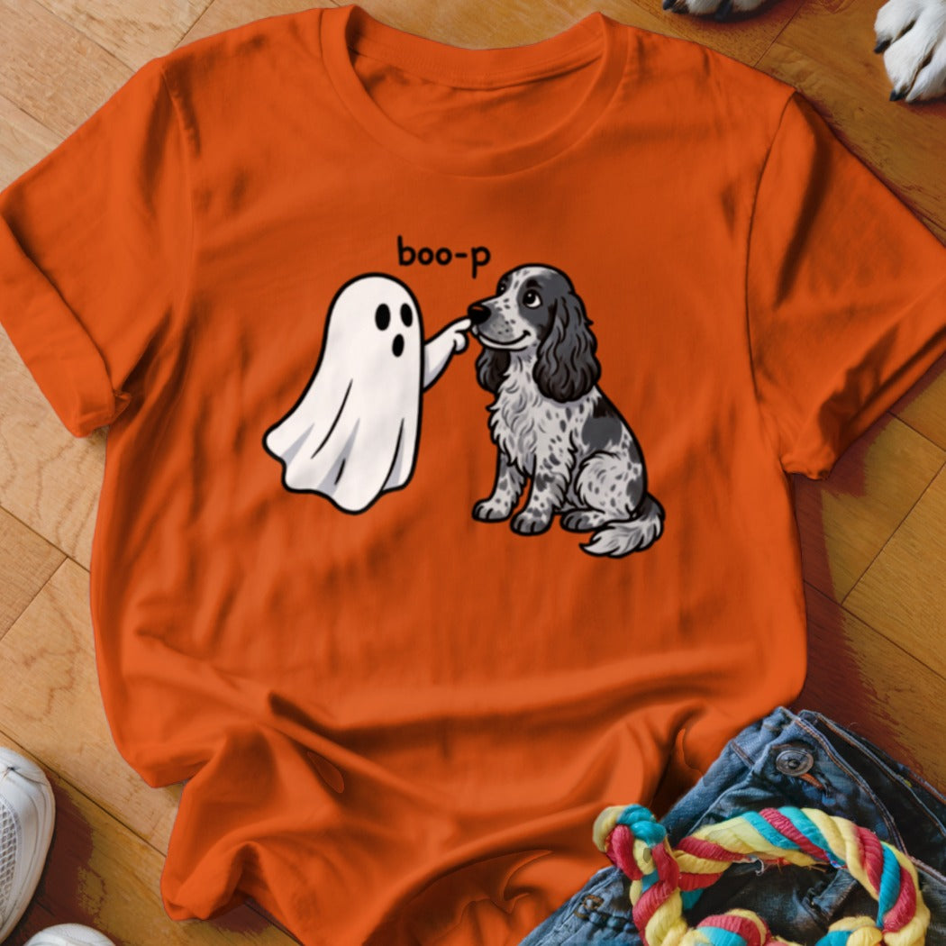 Ghost booping a dog's nose with text "boo-p" on orange t-shirt.