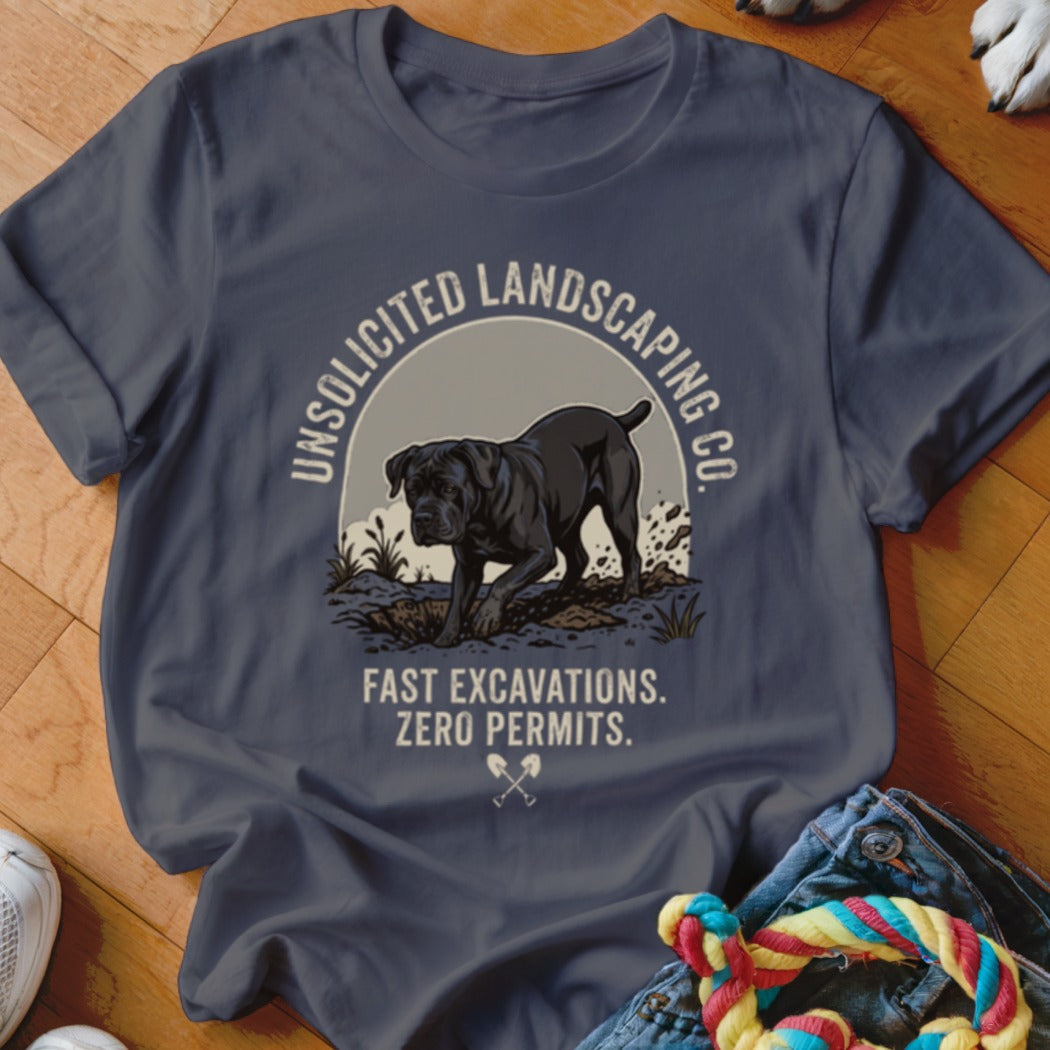 Dark t-shirt with graphic of a black dog, "Unsolicited Landscaping Co." and "Fast Excavations. Zero Permits."