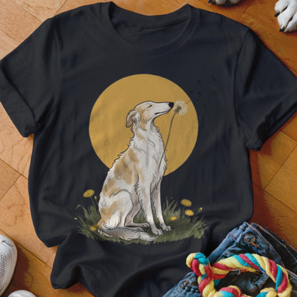 Black t-shirt featuring an illustration of a borzoi dog sitting in grass before a large yellow moon.