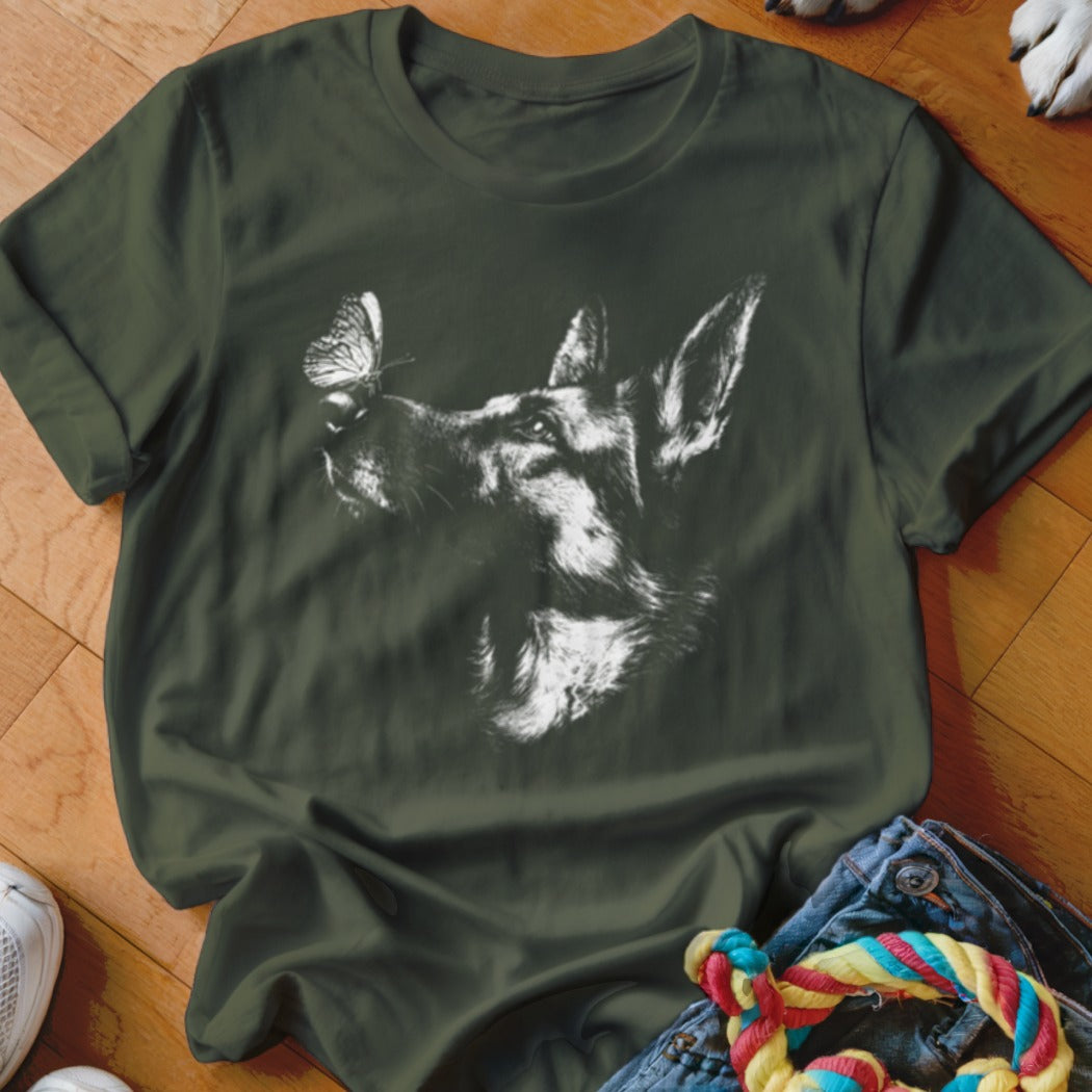 Dark green t-shirt featuring a white sketch of a German Shepherd with a butterfly on its nose.