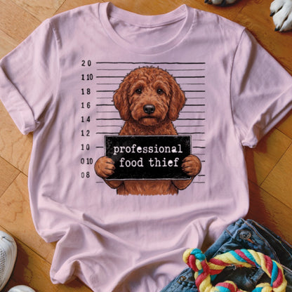 Goldendoodle holding a sign that reads "professional food thief".
